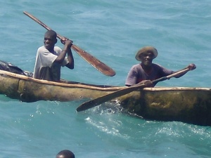 A couple Haitians paddling up the our ship.